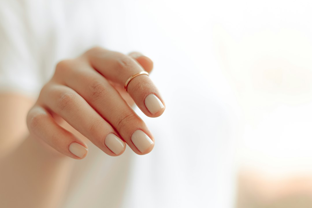 Gel polish lifting near the cuticle on a manicure